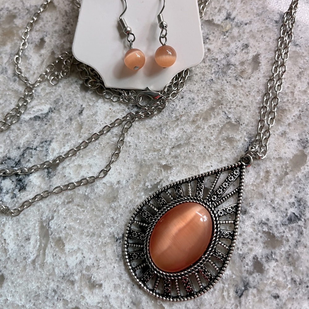 Orange Cat Eye Pendant with 34” Silver Chain